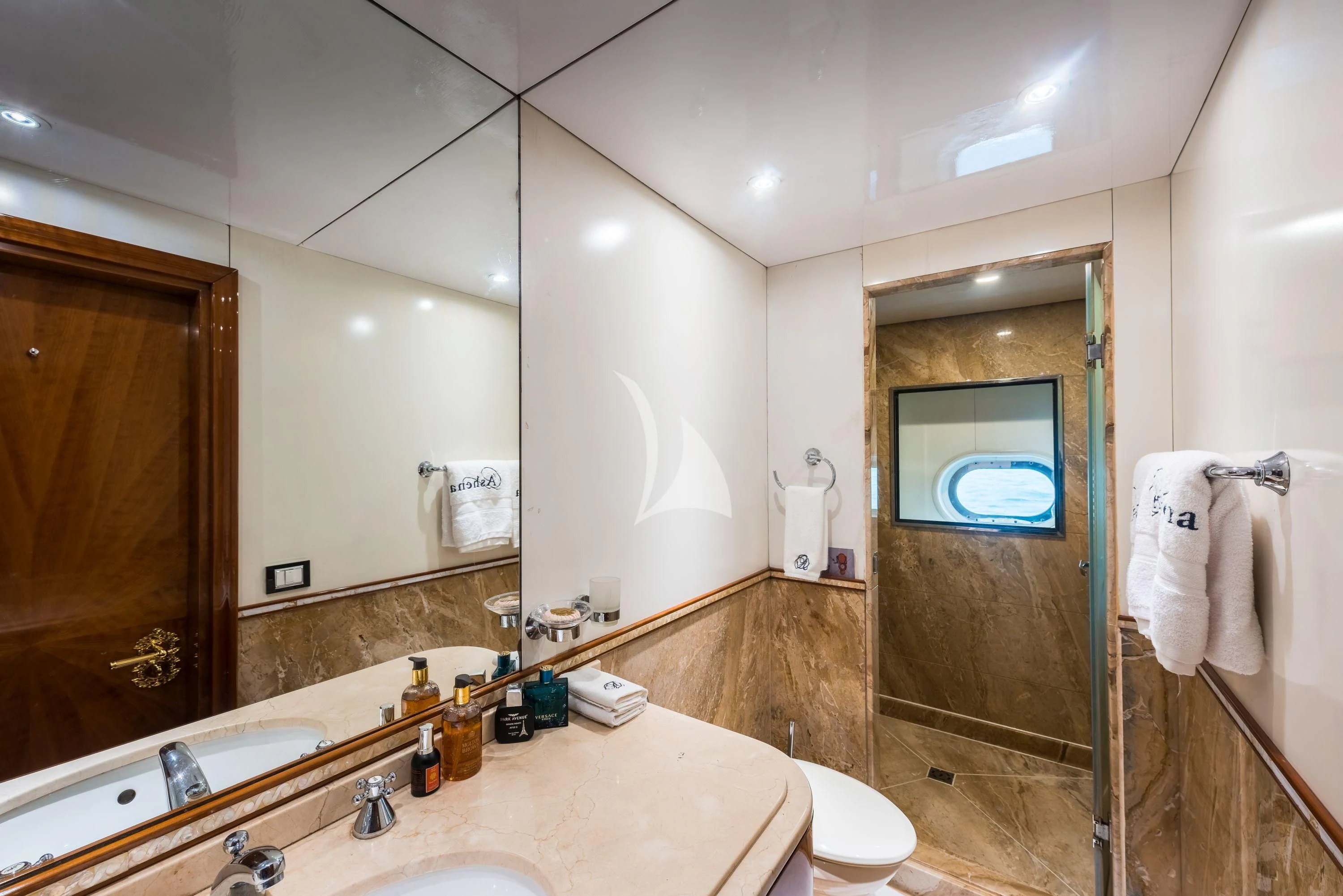 a bathroom with a large mirror aboard ASHENA Yacht for Charter