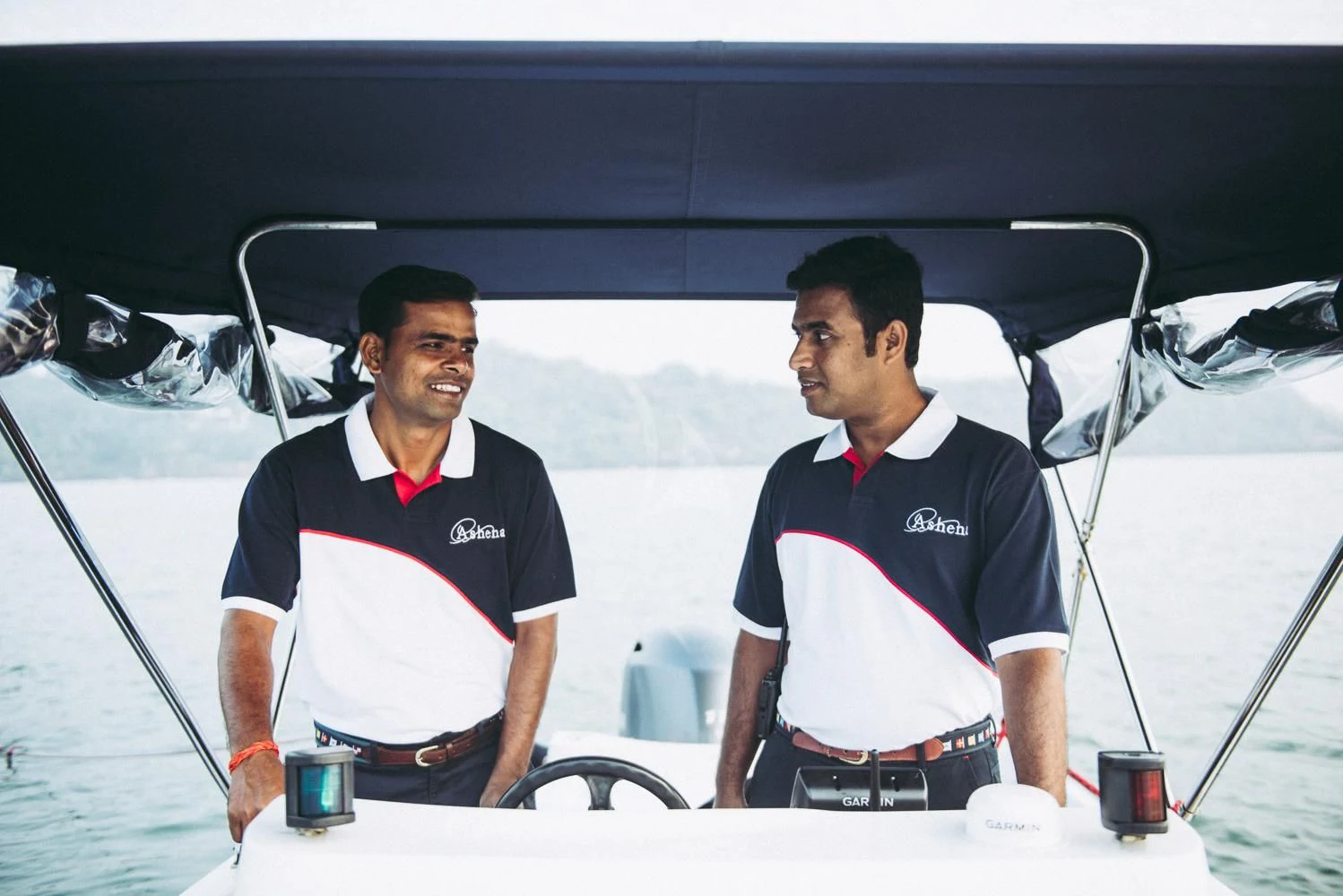 two men on a boat aboard ASHENA Yacht for Charter