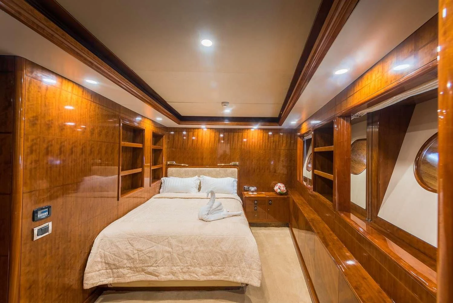 a room with a bed and a wood wall aboard ASHENA Yacht for Charter