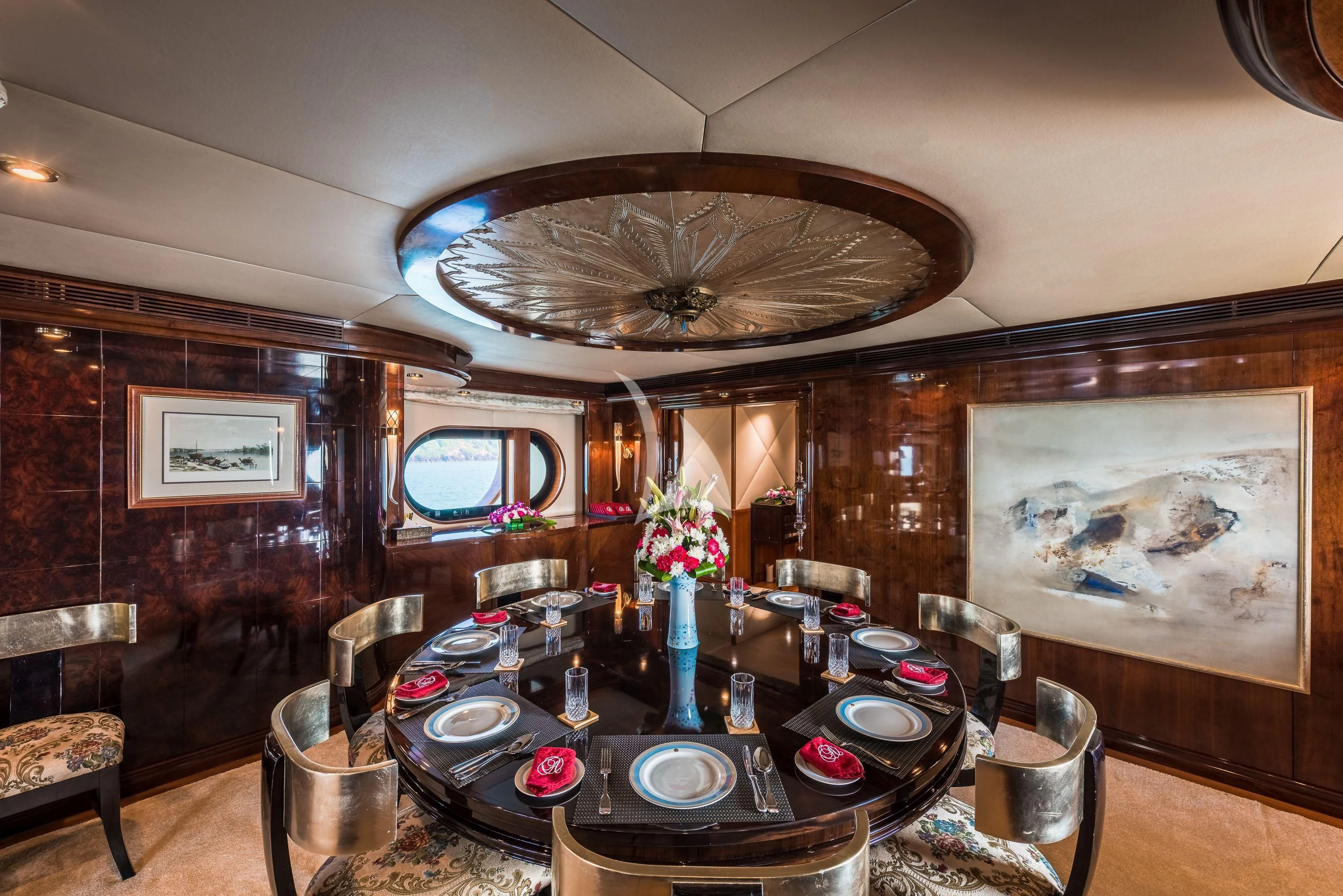 a large room with a chandelier and a table aboard ASHENA Yacht for Charter