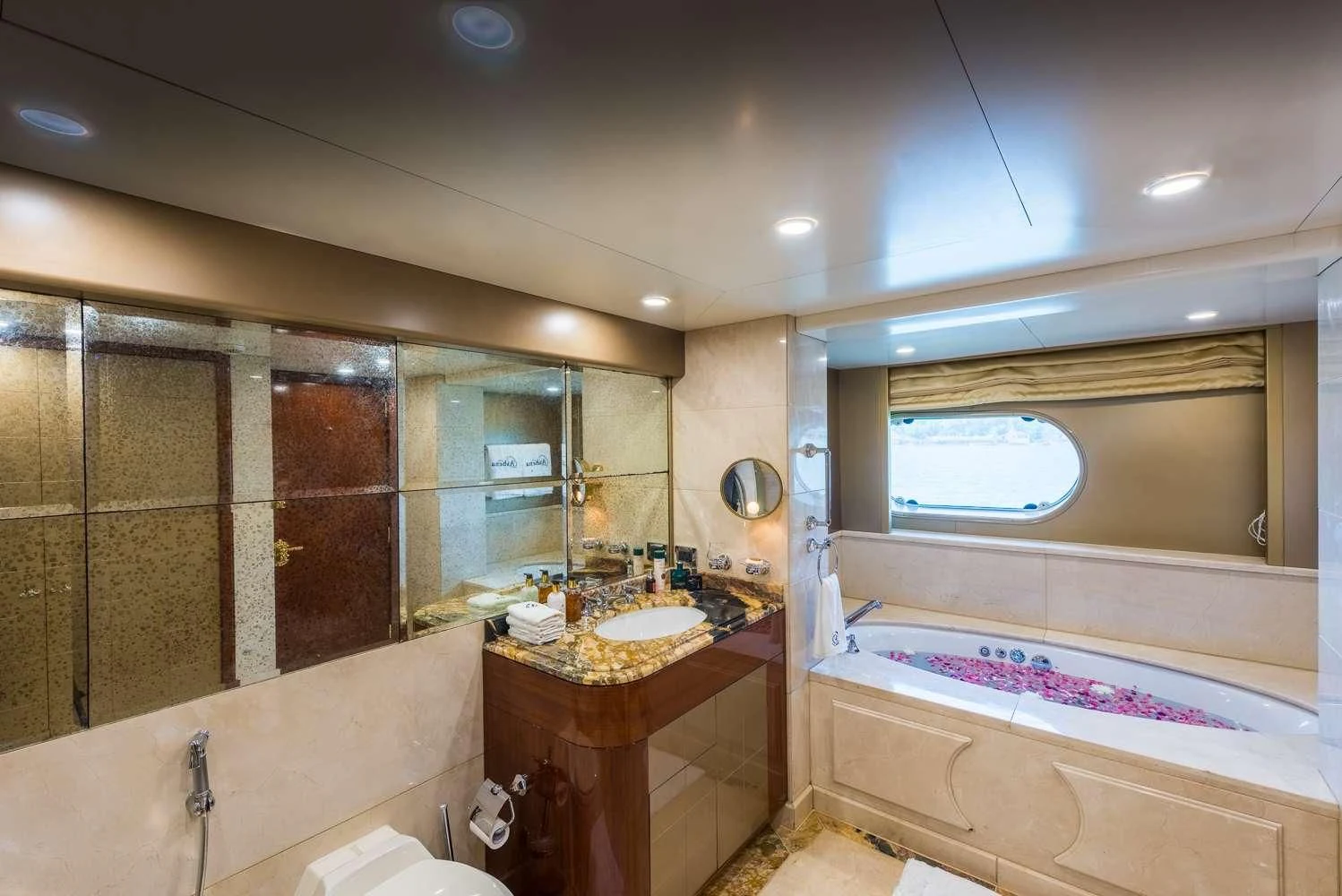a bathroom with a sink and a bathtub aboard ASHENA Yacht for Charter