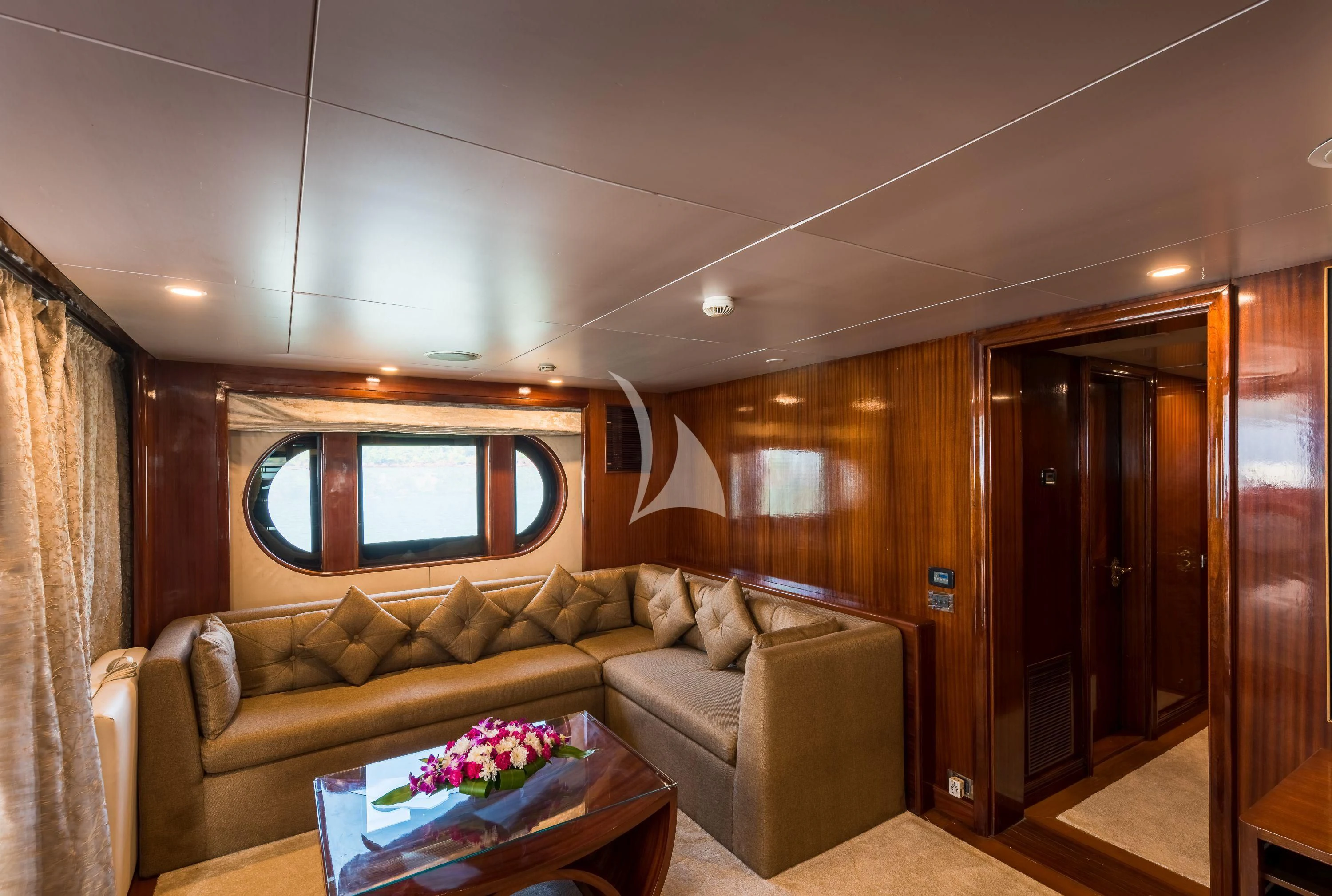 a living room with a couch and a television aboard ASHENA Yacht for Charter