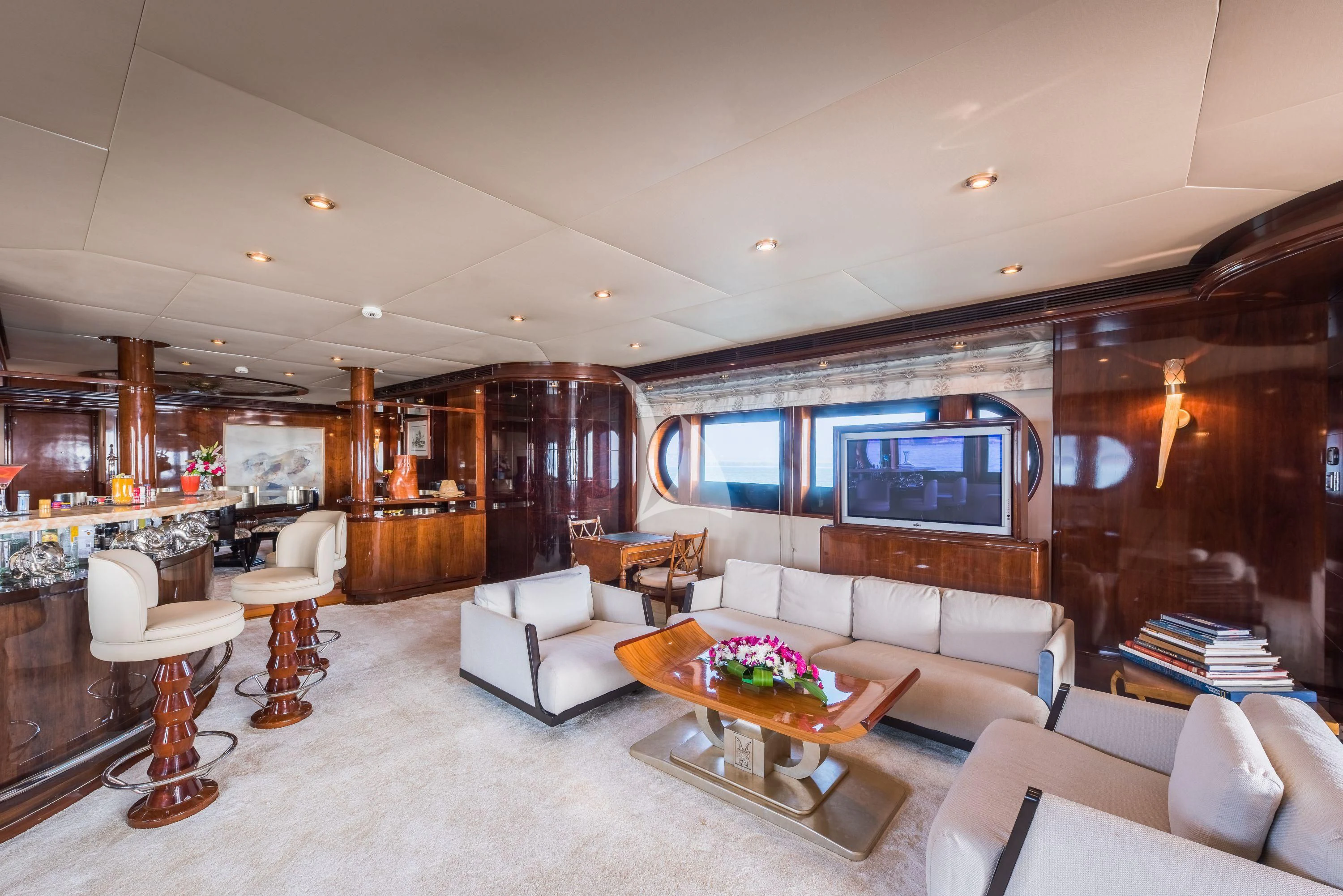 a living room with a large screen aboard ASHENA Yacht for Charter