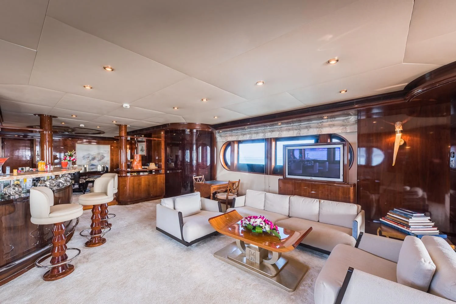 a living room with a large fireplace aboard ASHENA Yacht for Charter