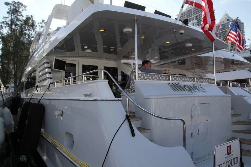a boat with a flag on the front aboard IRON LADY Yacht for Sale