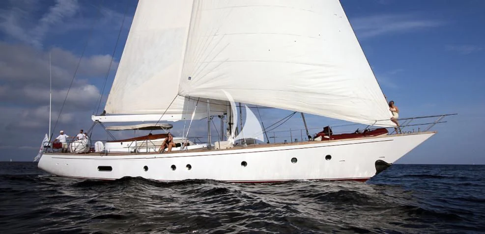 a white sailboat on the water aboard MALIZIA Yacht for Sale