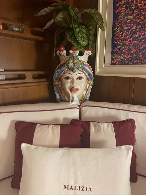 a vase with a woman's face on it aboard MALIZIA Yacht for Sale