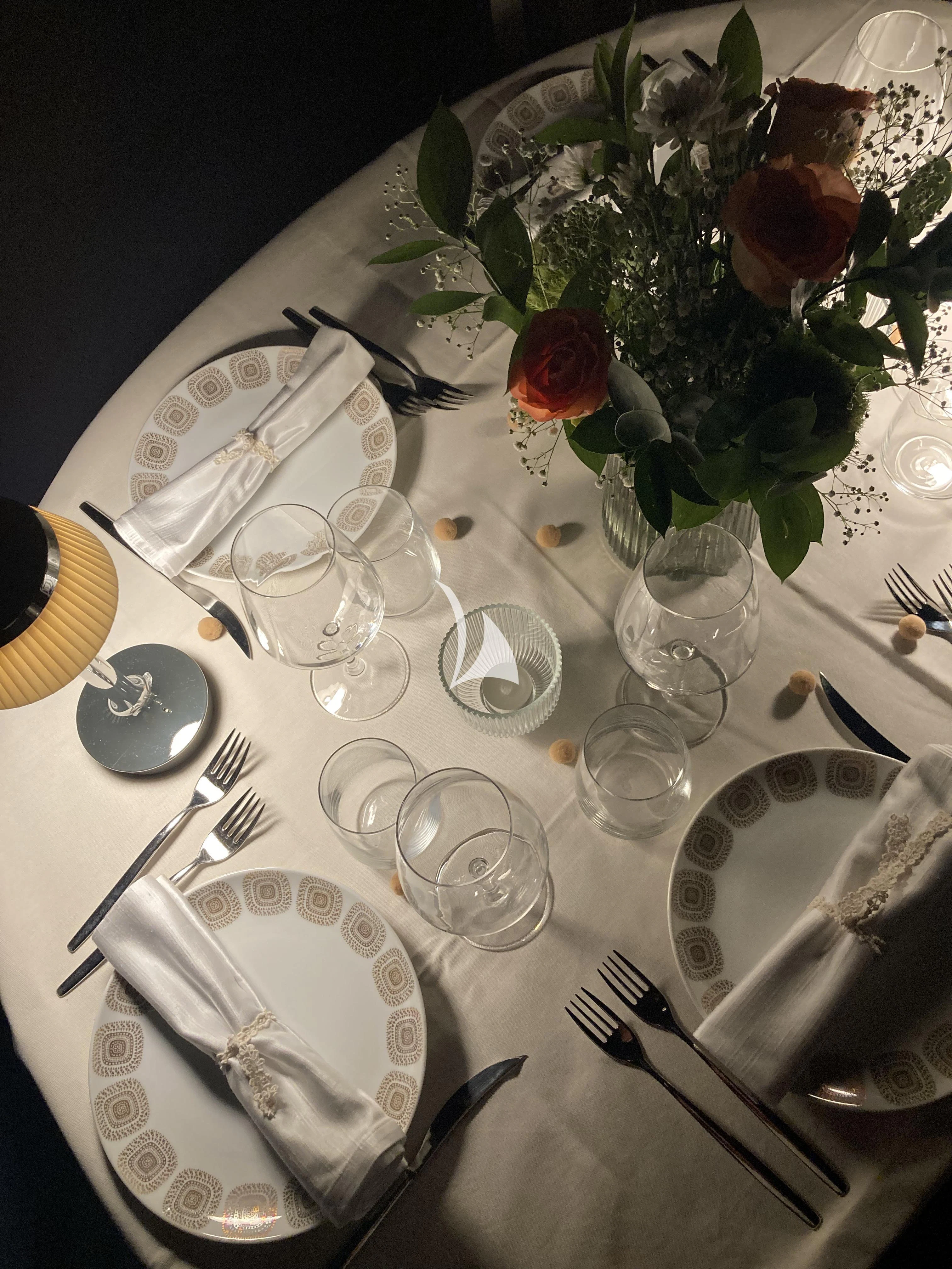 a table with silverware and silverware aboard MALIZIA Yacht for Sale