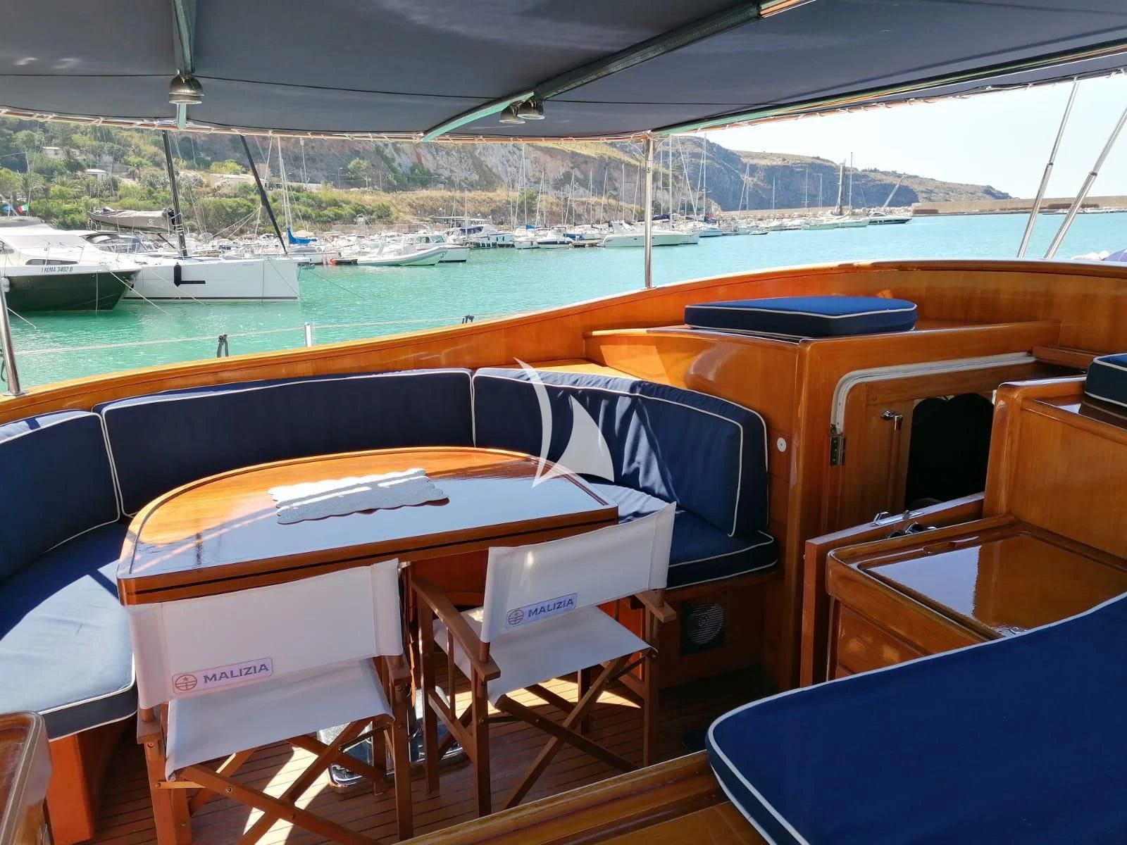 a boat on a deck aboard MALIZIA Yacht for Sale