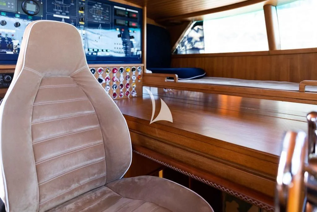 a computer on a table aboard MALIZIA Yacht for Sale