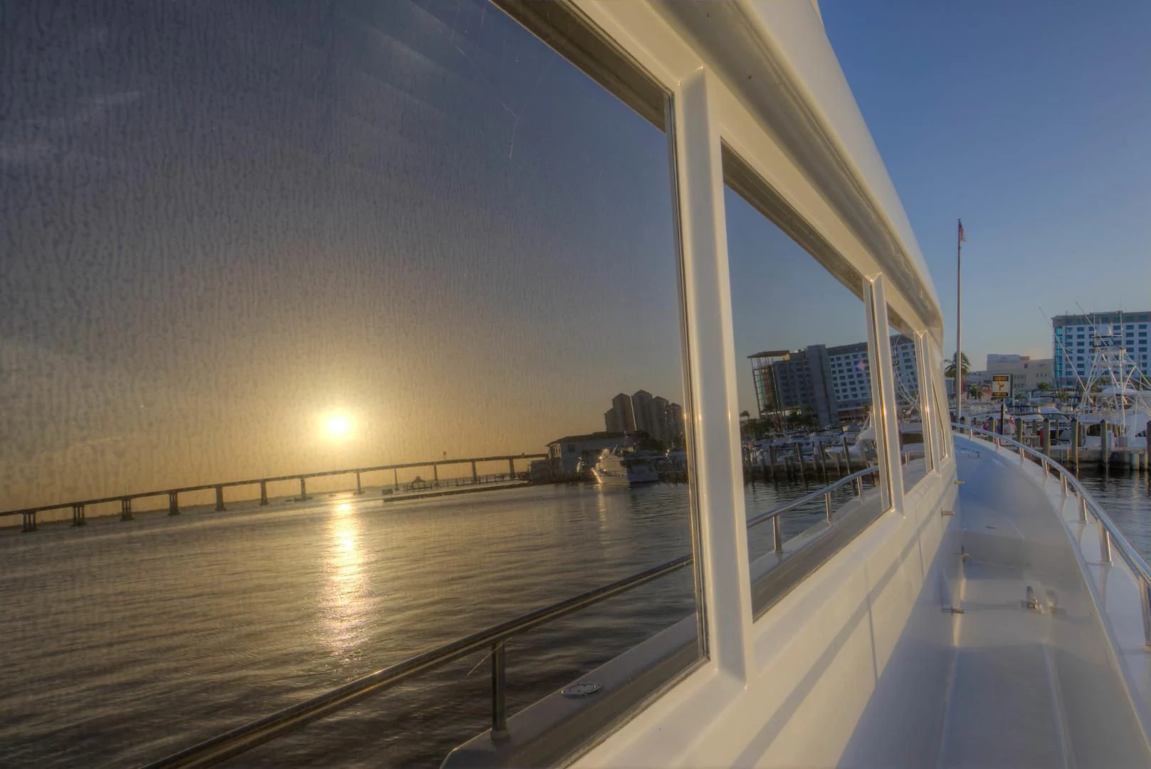 a large building with a body of water in the front aboard LADY LEX Yacht for Sale