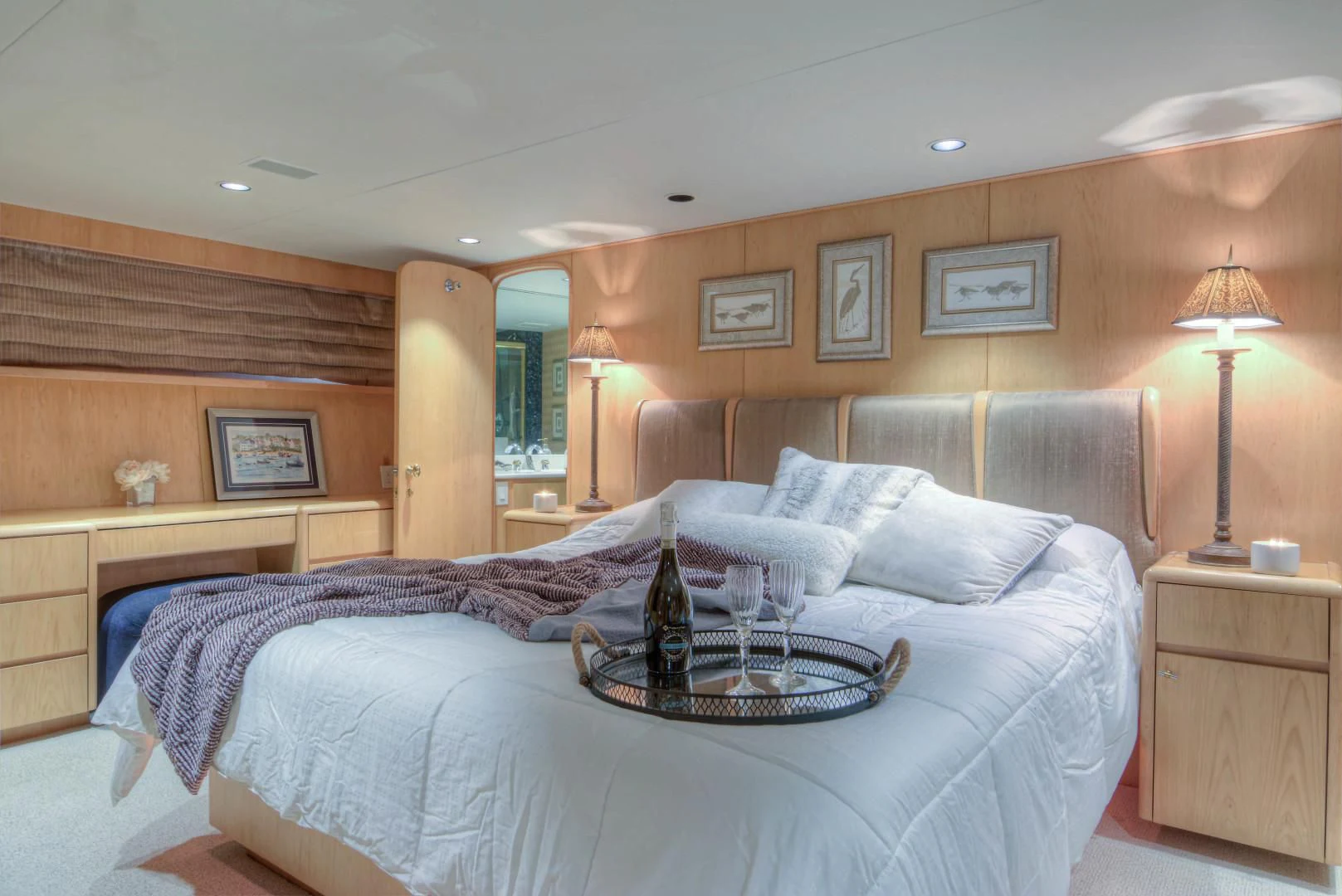 a bed with a glass table aboard LADY LEX Yacht for Sale