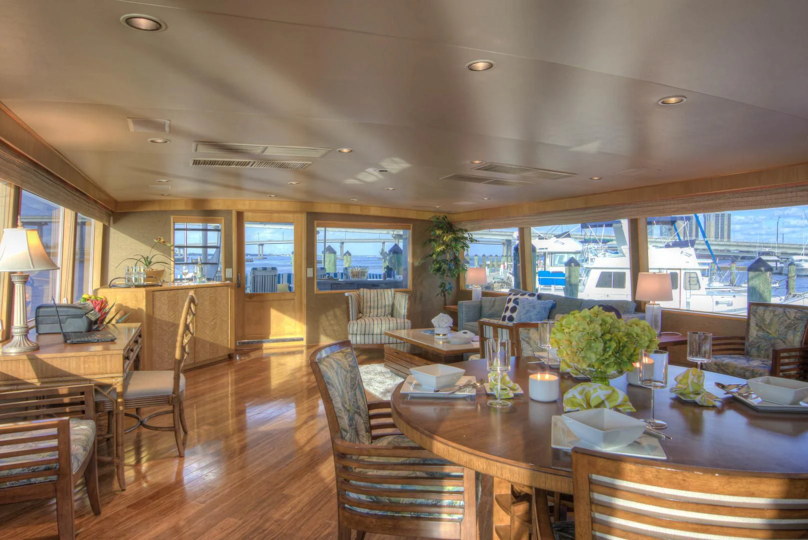a living room with a wood floor aboard LADY LEX Yacht for Sale