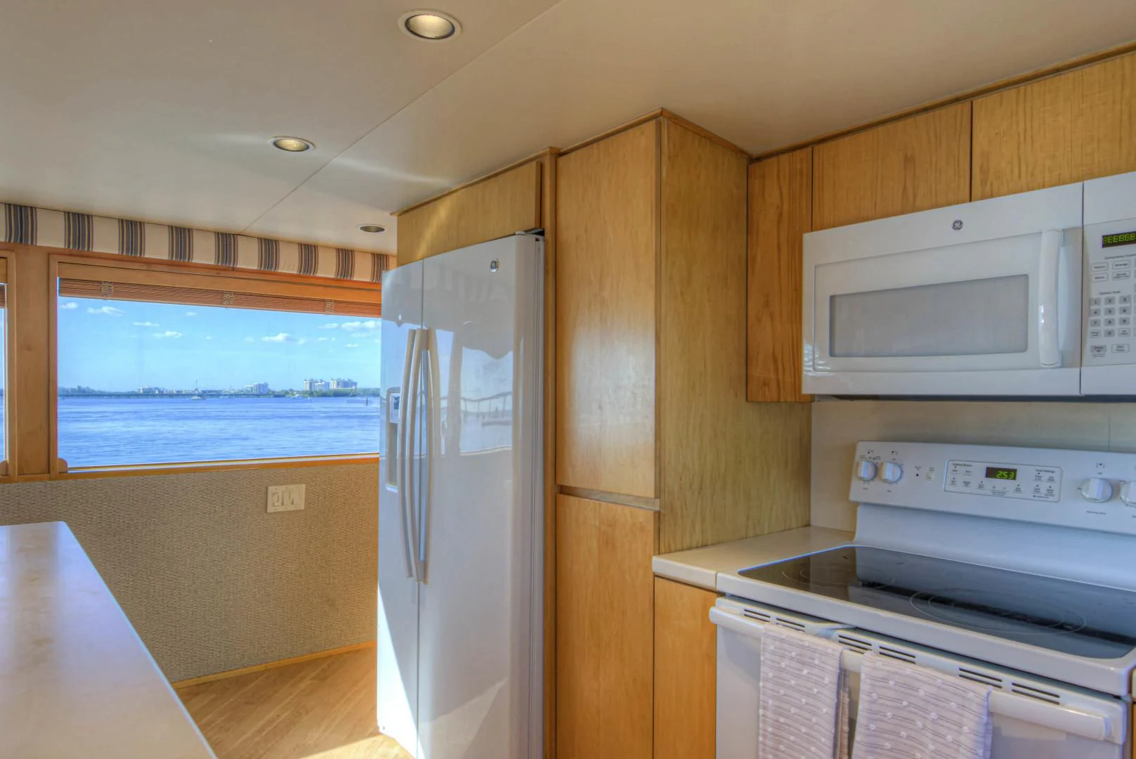 a kitchen with wooden cabinets aboard LADY LEX Yacht for Sale