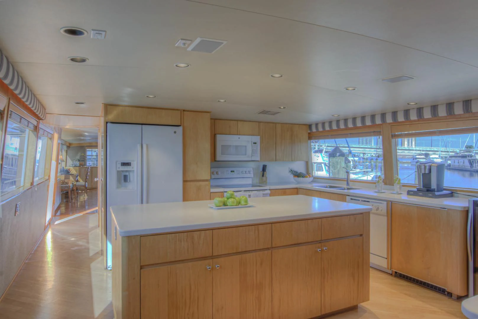 a kitchen with white cabinets aboard LADY LEX Yacht for Sale