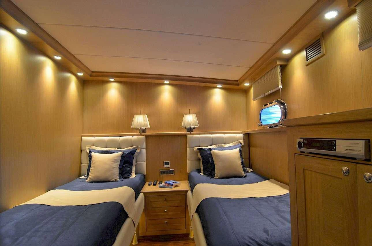 a room with two beds aboard BLUE HEAVEN Yacht for Charter