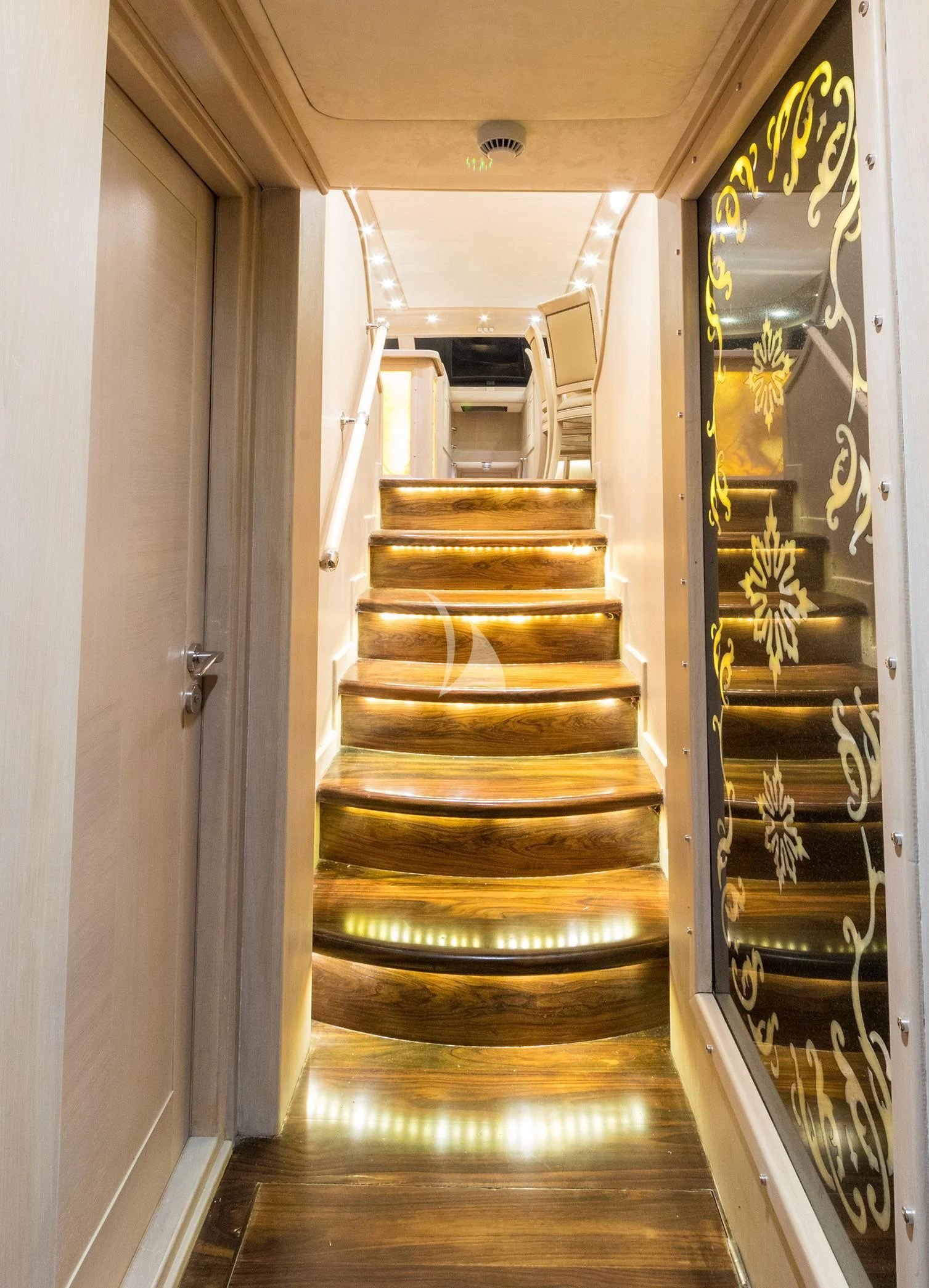 a hallway with a set of stairs aboard BLUE HEAVEN Yacht for Charter