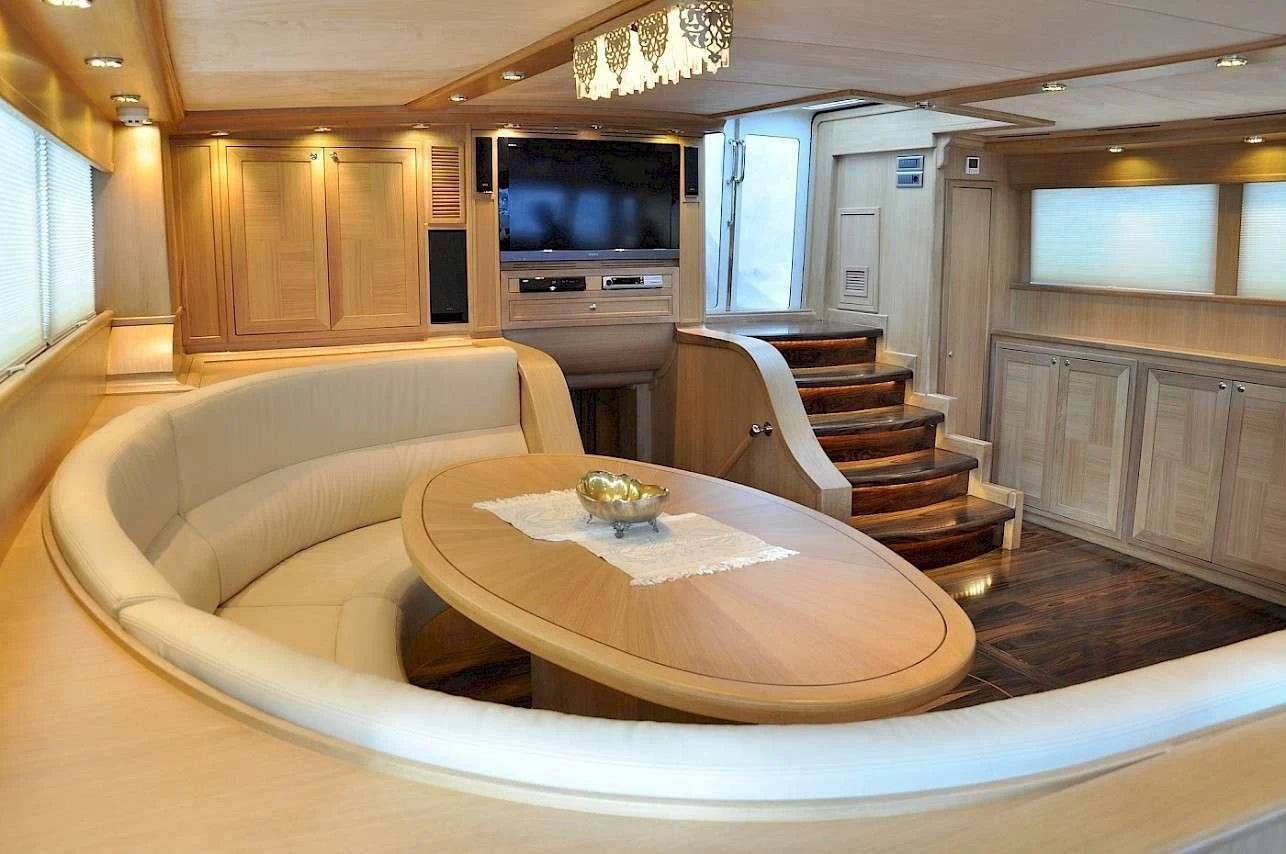 a living room with a couch and a television aboard BLUE HEAVEN Yacht for Charter