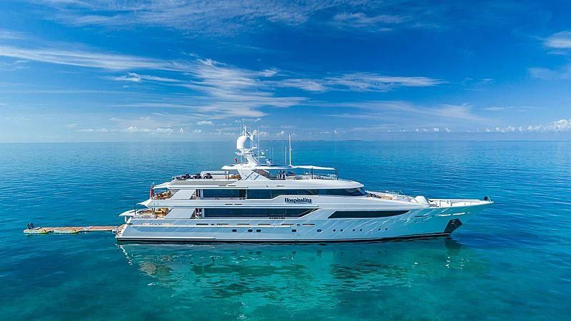 a white yacht in the water aboard AS YOU WISH Yacht for Sale