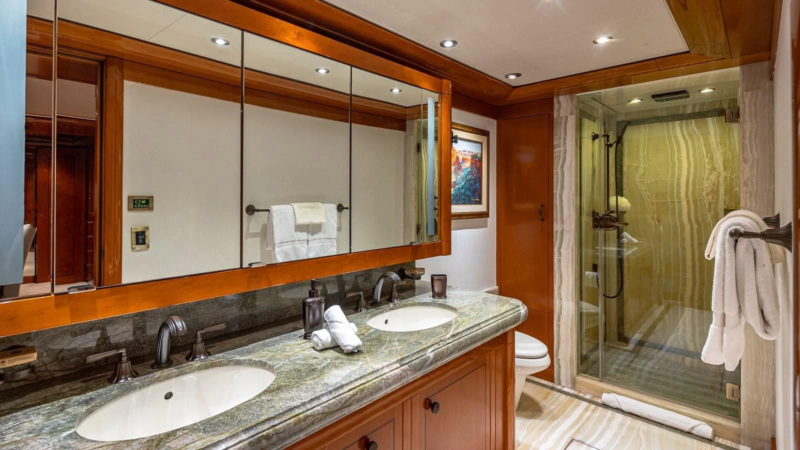 a bathroom with a large mirror aboard AS YOU WISH Yacht for Sale