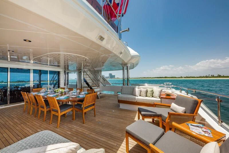 a room with a table chairs and a large body of water aboard AS YOU WISH Yacht for Sale
