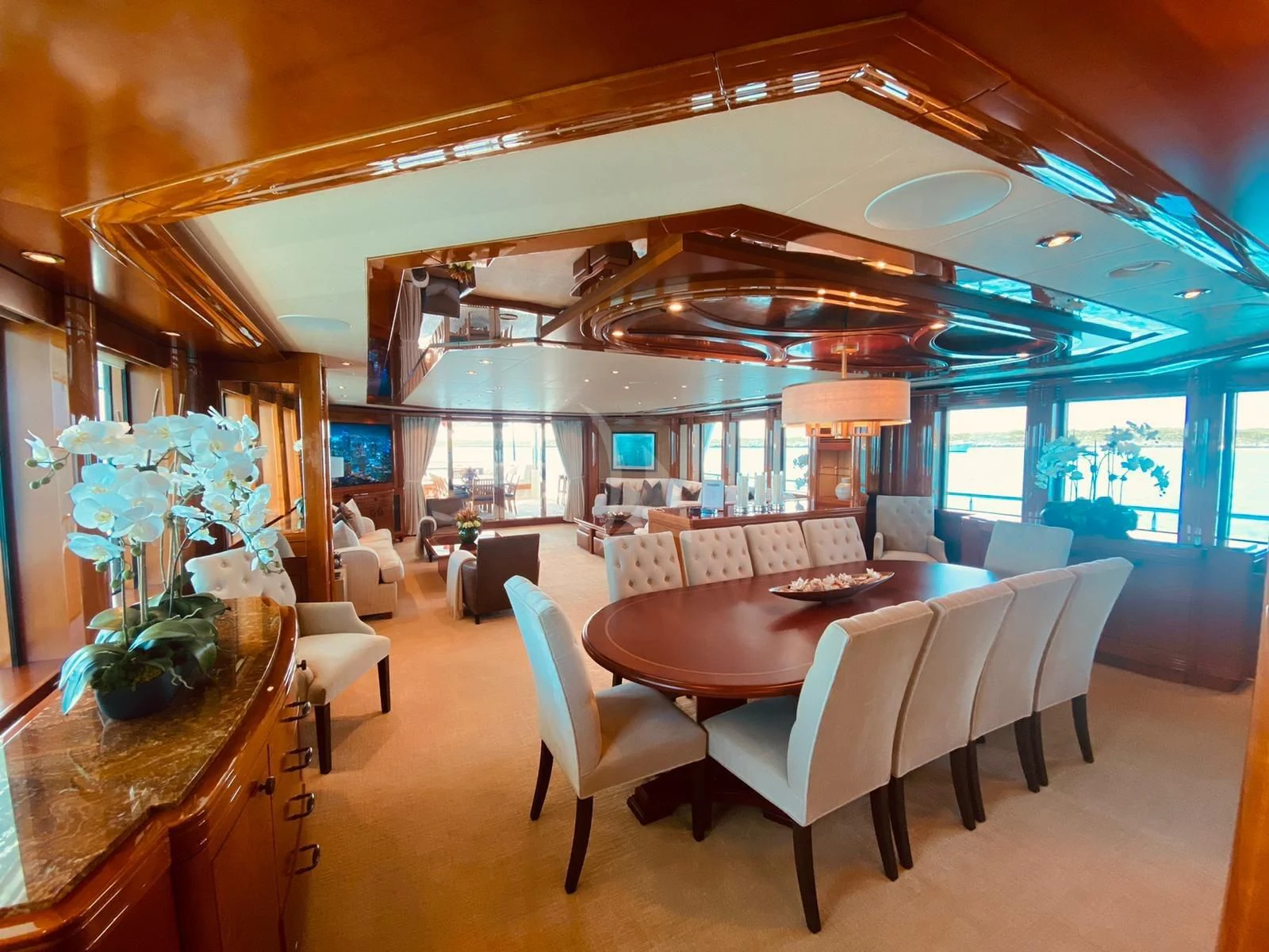 a room with a table chairs and a large window aboard AS YOU WISH Yacht for Sale