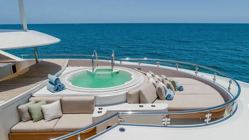 a swimming pool with a large jacuzzi on the deck aboard AS YOU WISH Yacht for Sale