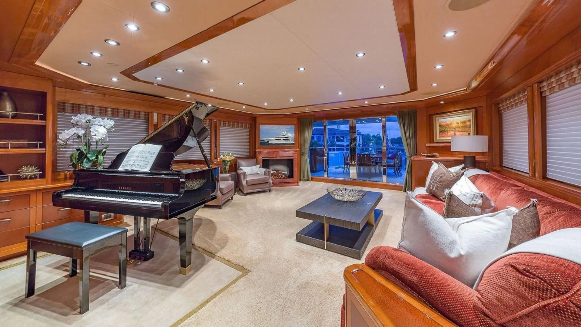a living room with a piano aboard AS YOU WISH Yacht for Sale