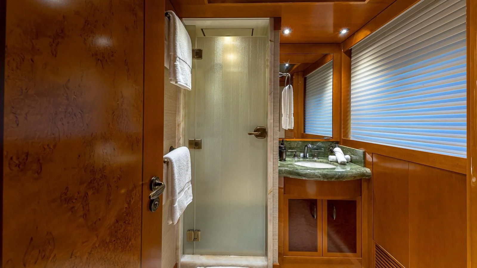a bathroom with a sink and a shower aboard AS YOU WISH Yacht for Sale