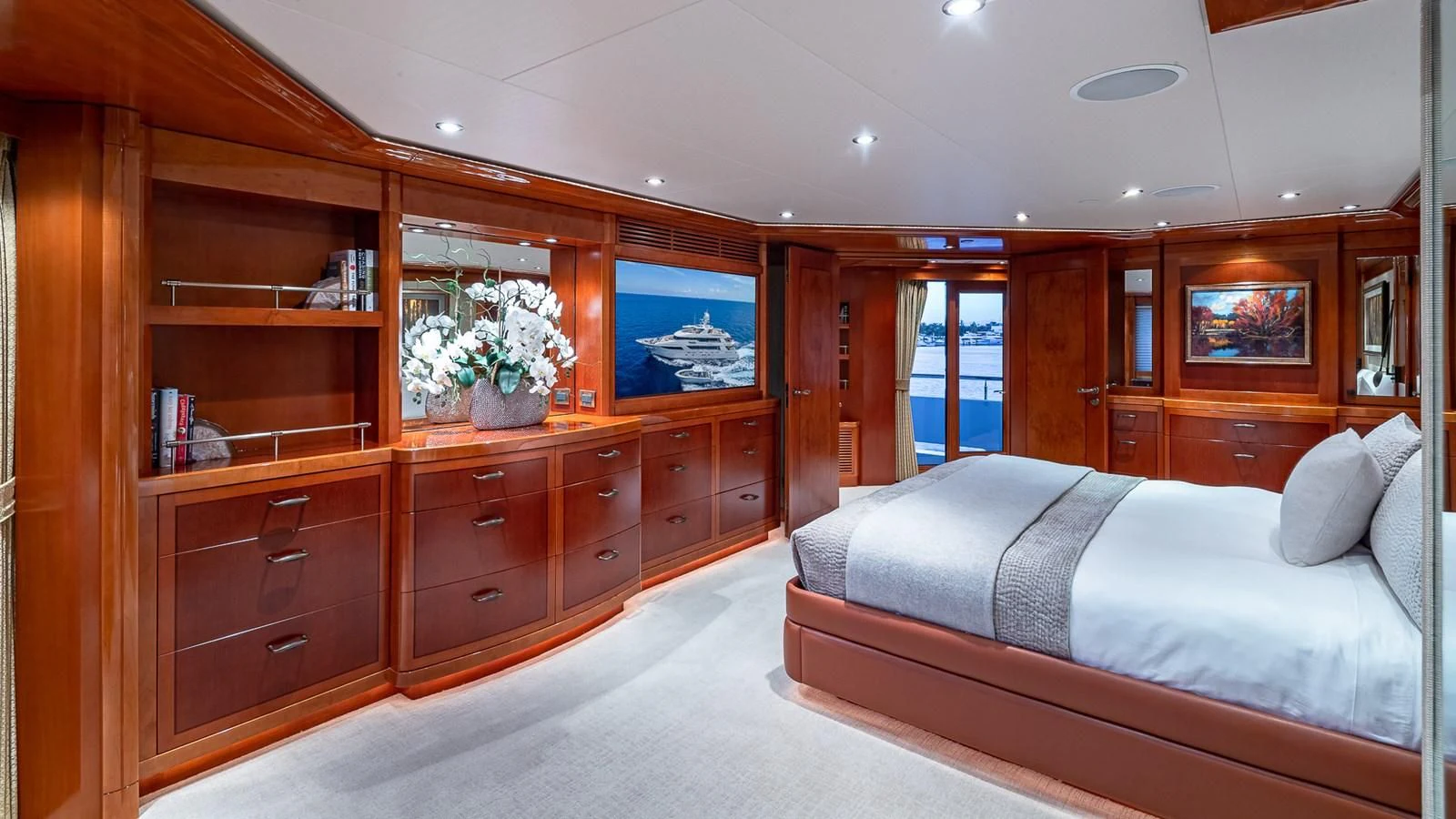 a bedroom with a bed and a desk aboard AS YOU WISH Yacht for Sale