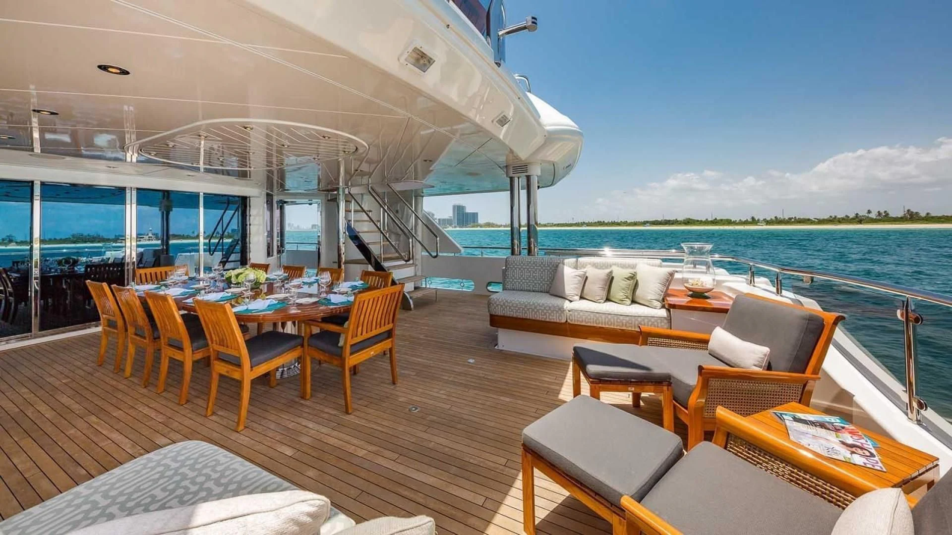 a large living room with a large balcony overlooking the ocean aboard AS YOU WISH Yacht for Sale