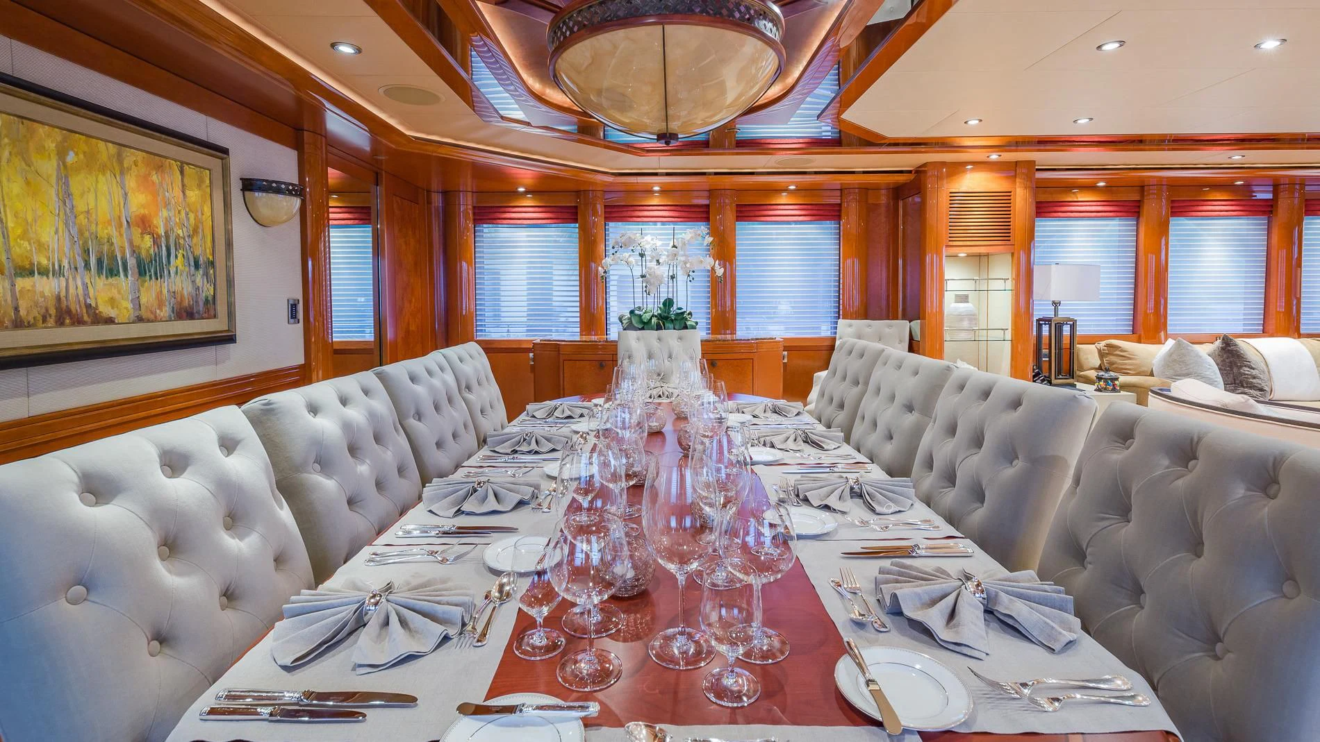 a large dining table with a chandelier aboard AS YOU WISH Yacht for Sale