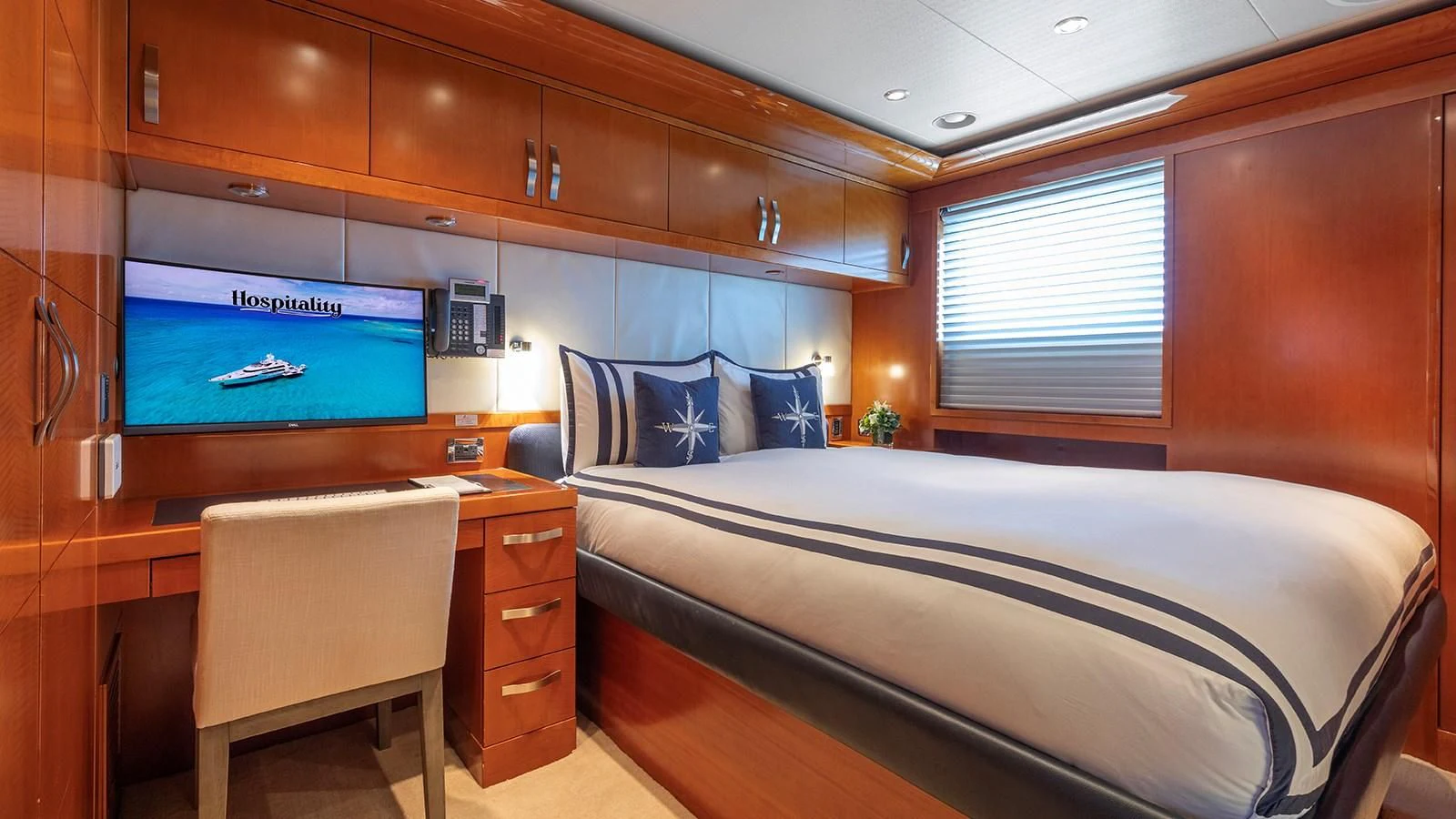 a room with a bed and a tv on the wall aboard AS YOU WISH Yacht for Sale