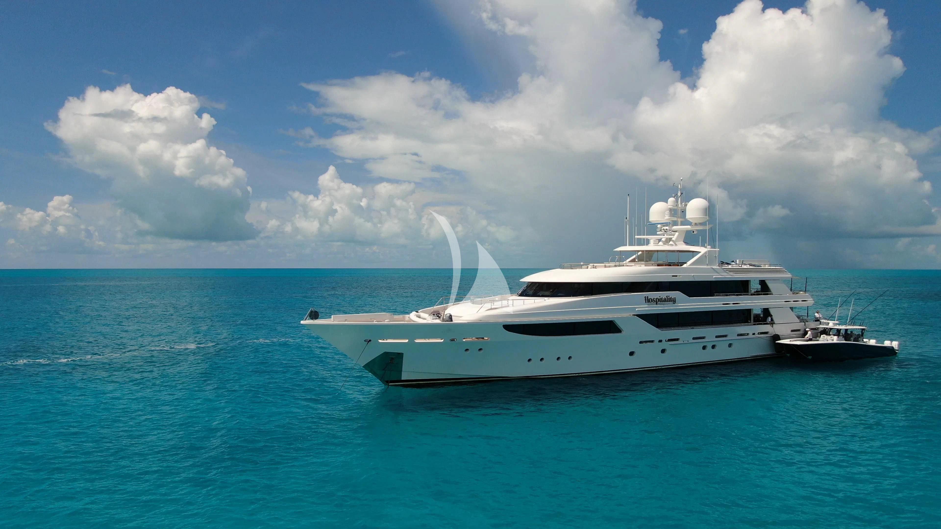 a white yacht in the ocean aboard AS YOU WISH Yacht for Sale