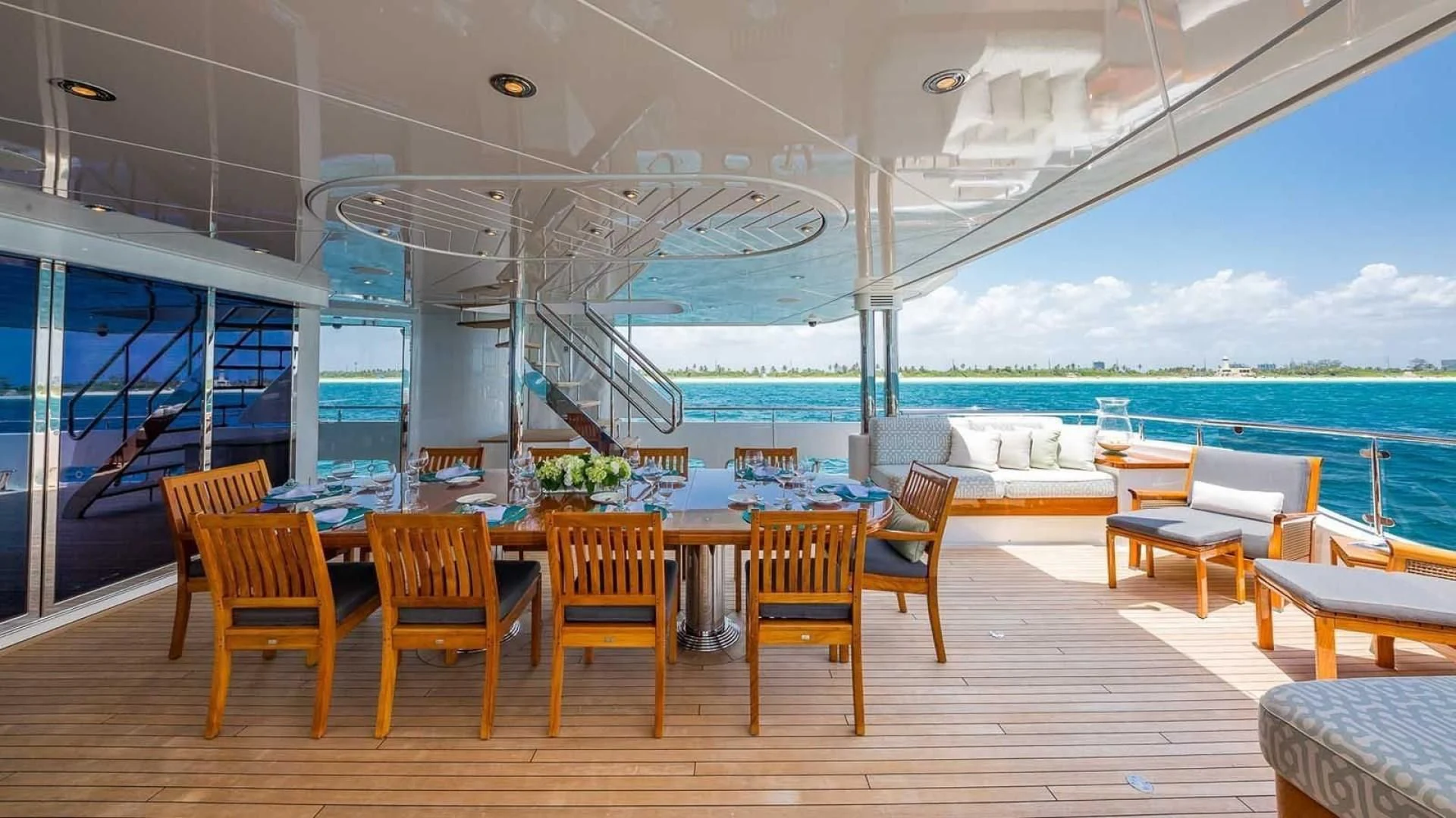 a room with a table chairs and a large window aboard AS YOU WISH Yacht for Sale