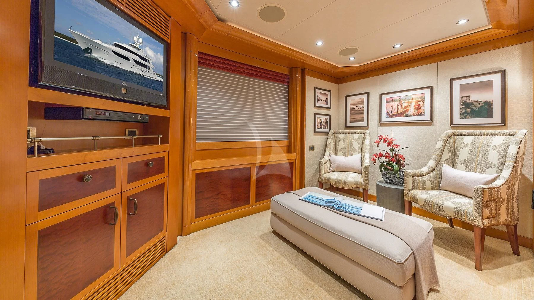 a room with a tv and a chair aboard AS YOU WISH Yacht for Sale