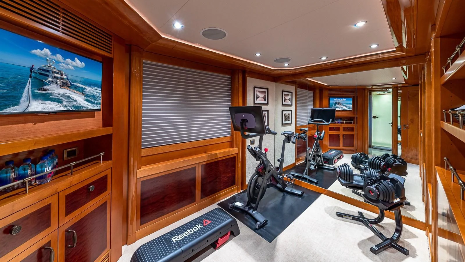 a room with a television and a desk with a computer aboard AS YOU WISH Yacht for Sale