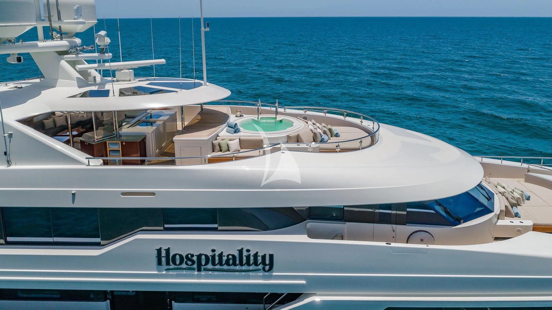 a white yacht on the water aboard AS YOU WISH Yacht for Sale