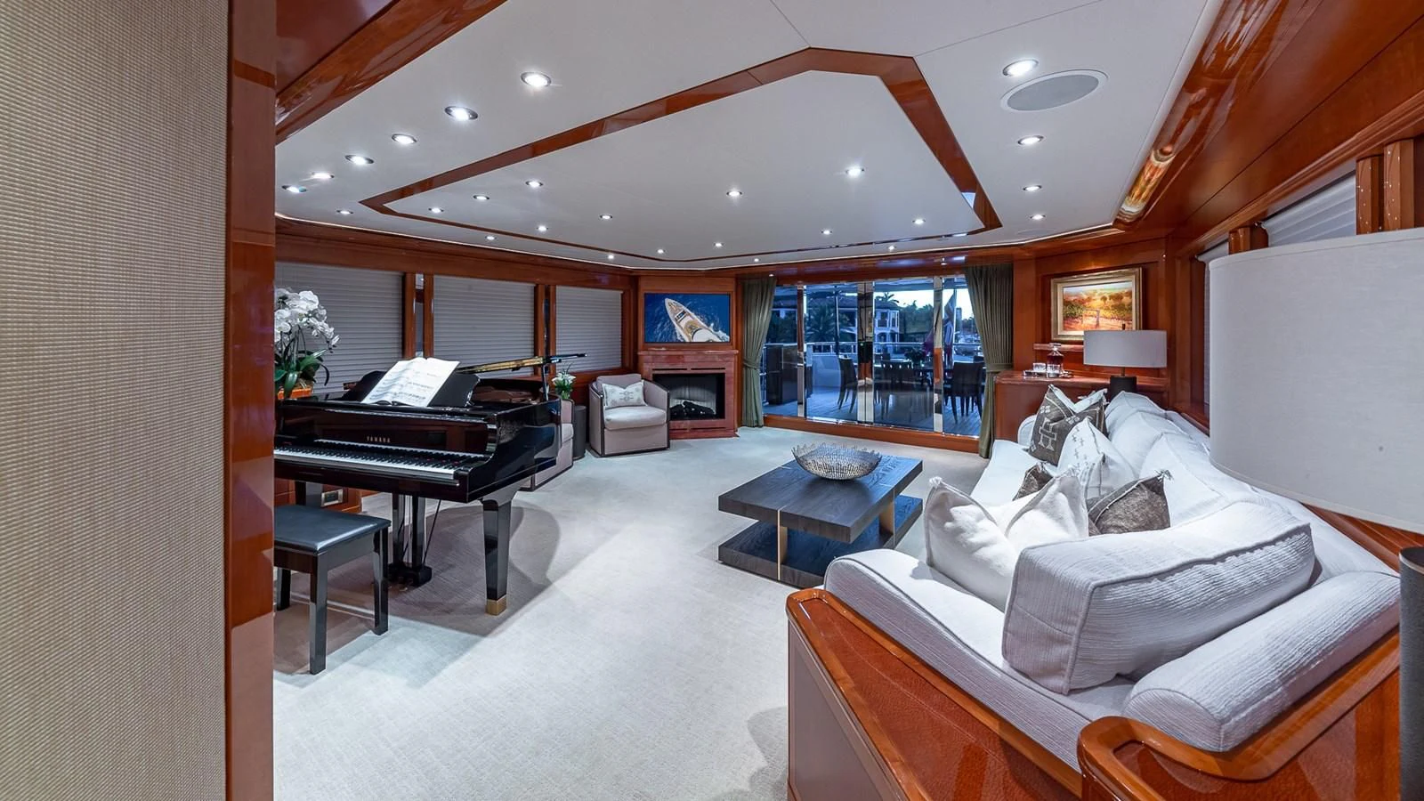 a living room with a piano aboard AS YOU WISH Yacht for Sale