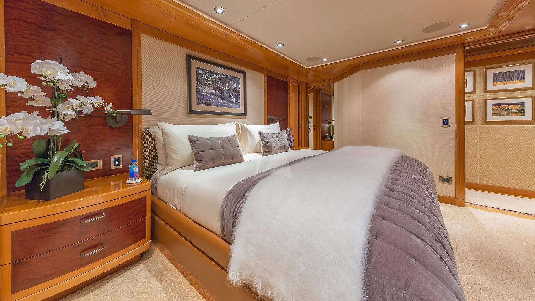 a bedroom with a bed and a plant aboard AS YOU WISH Yacht for Sale