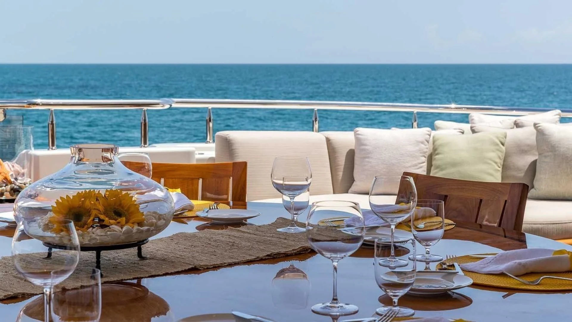 a table with glasses and food on it aboard AS YOU WISH Yacht for Sale