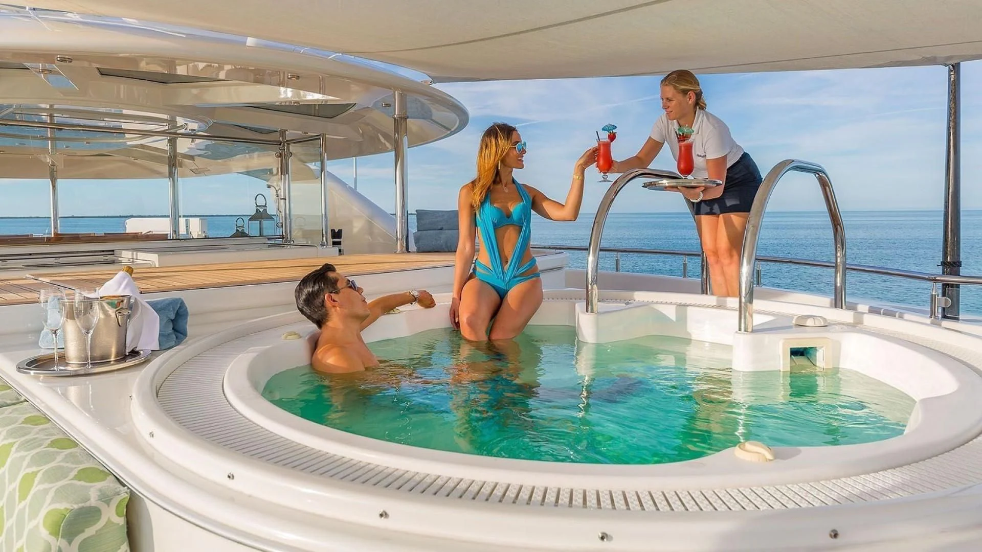 a man and woman in a swimming pool aboard AS YOU WISH Yacht for Sale