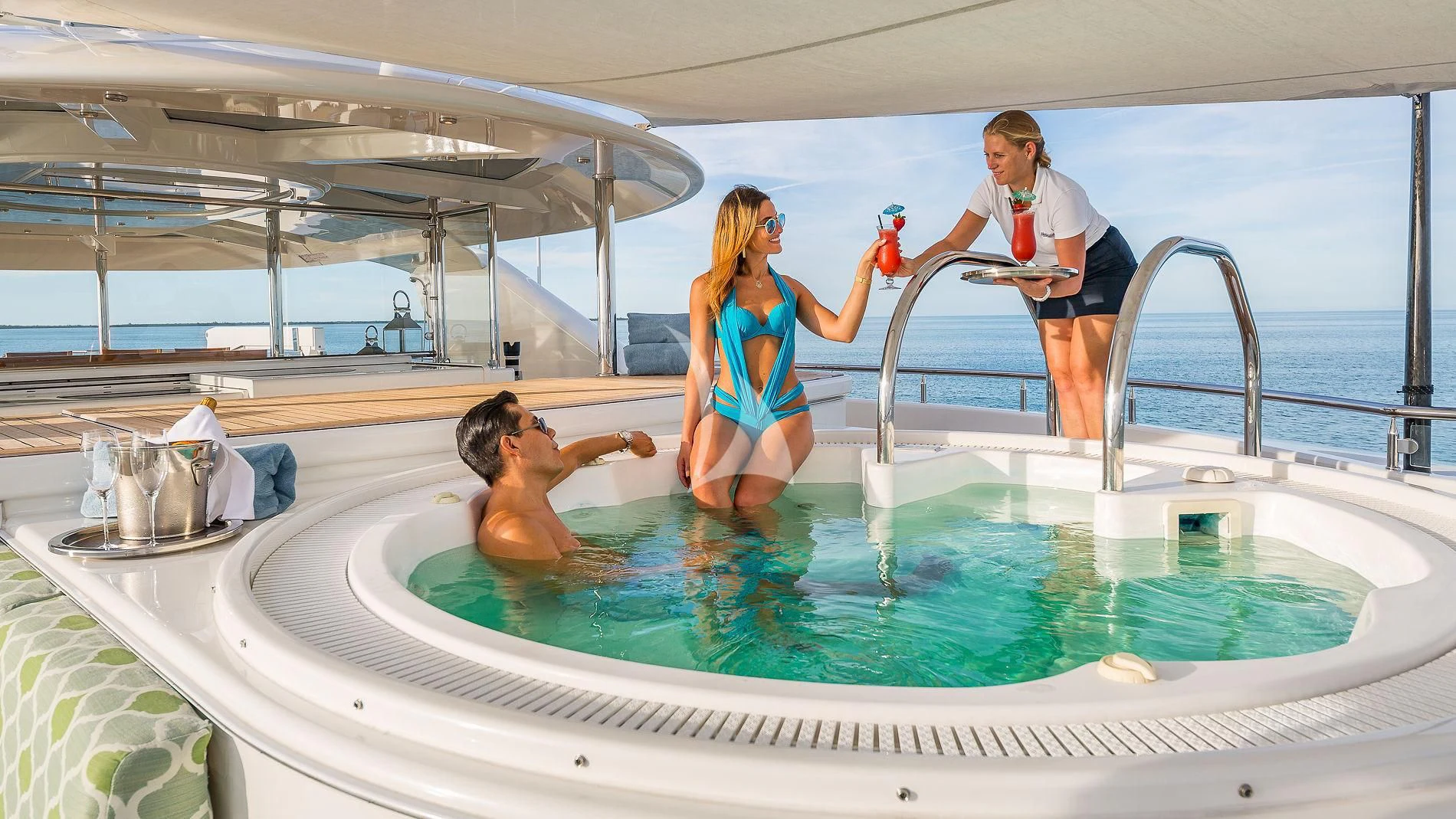 a man and woman in a bathtub aboard AS YOU WISH Yacht for Sale