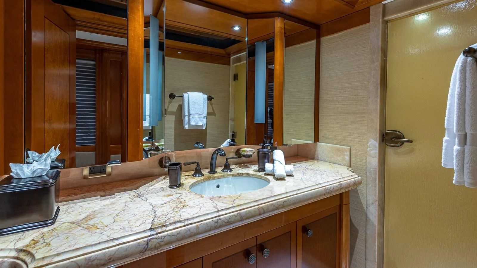 a bathroom with a countertop sink and mirror aboard AS YOU WISH Yacht for Sale