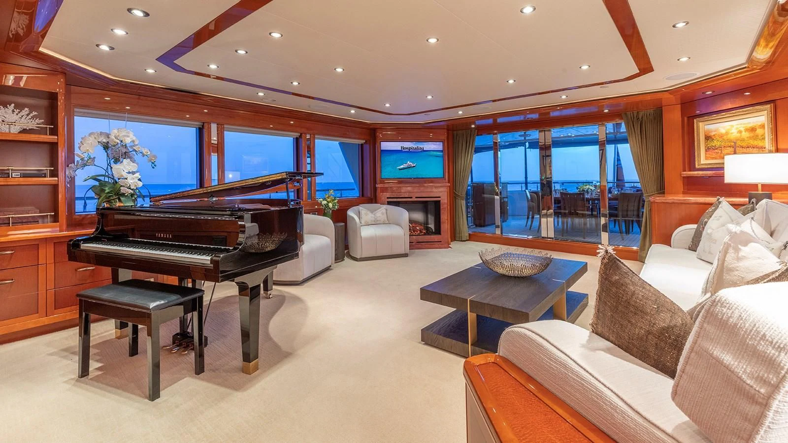 a large living room with a piano aboard AS YOU WISH Yacht for Sale