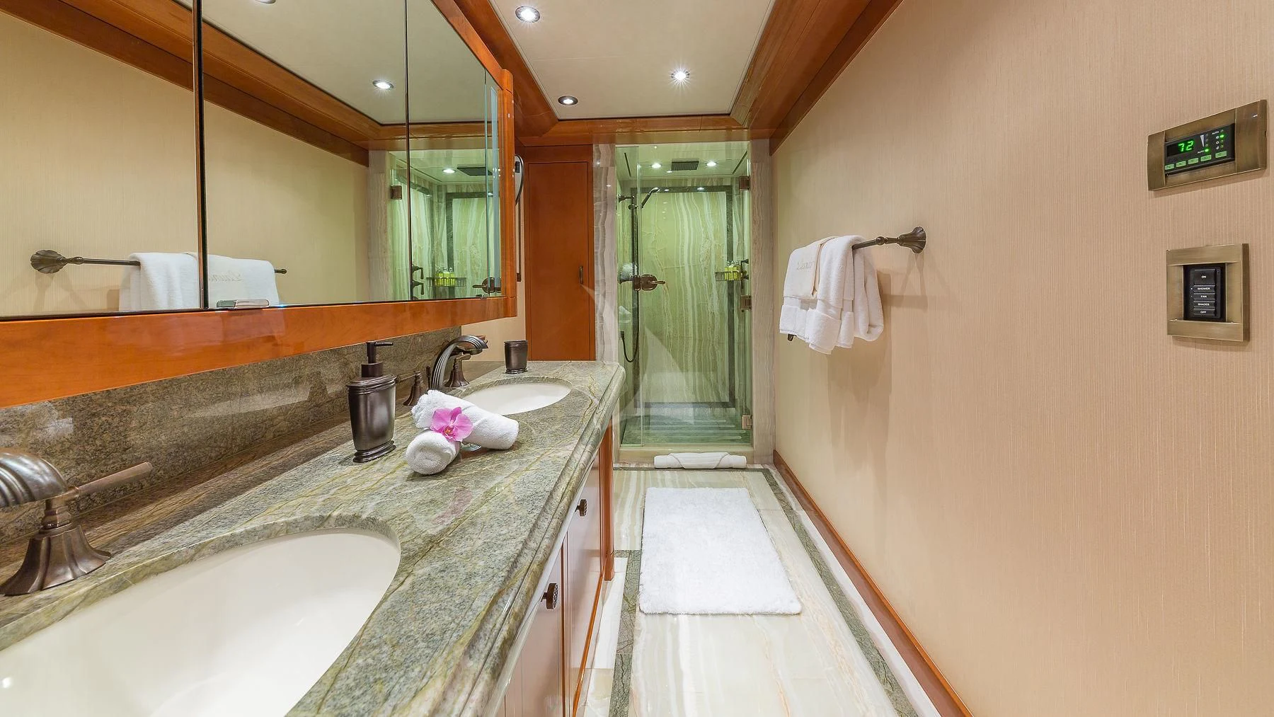a bathroom with a countertop sink and a large mirror aboard AS YOU WISH Yacht for Sale