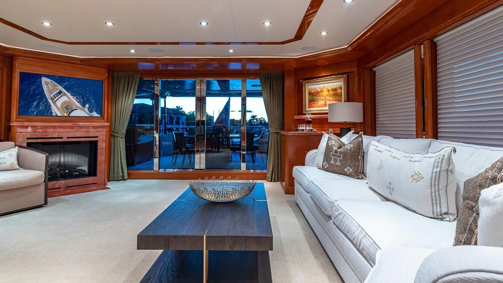 a living room with a fireplace aboard AS YOU WISH Yacht for Sale