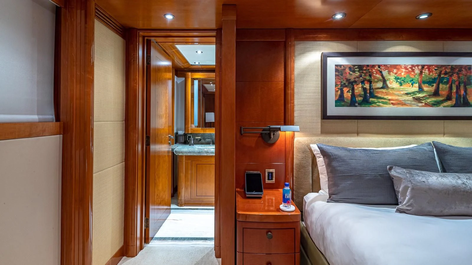 a bedroom with a bed and a desk aboard AS YOU WISH Yacht for Sale