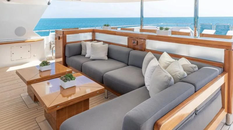 a living room with a couch and a table aboard AS YOU WISH Yacht for Sale