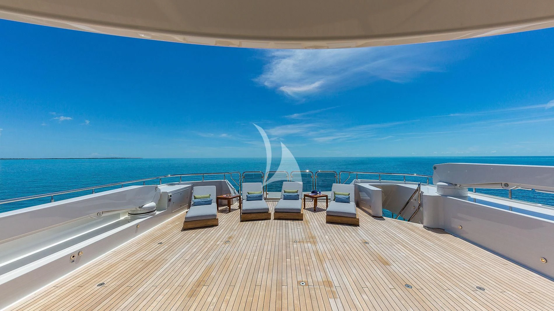 a deck with chairs on it and a body of water in the background aboard AS YOU WISH Yacht for Sale
